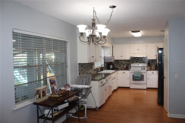 kitchen featuring sink, white electric stove, white cabinetry, a chandelier, and dark hardwood / wood-style floors