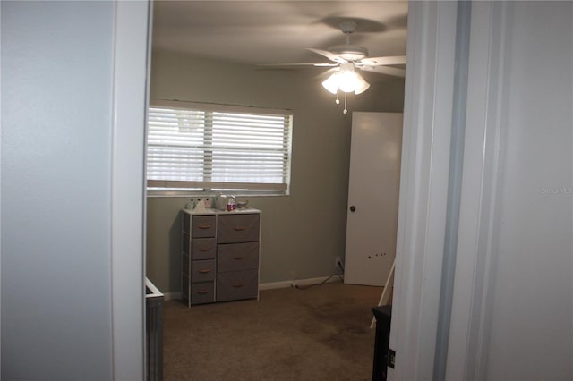 carpeted bedroom with baseboards and ceiling fan