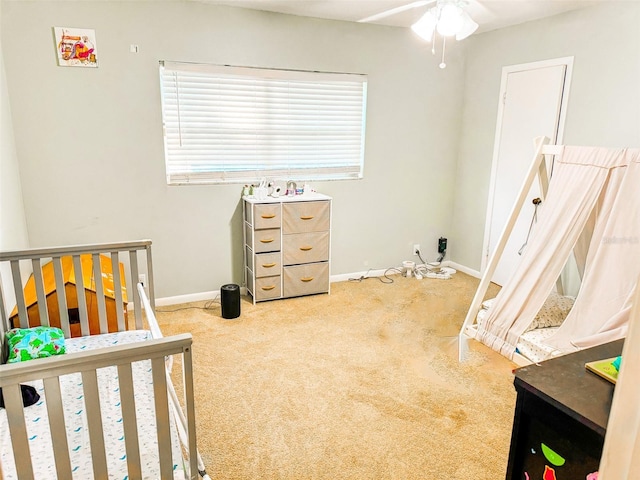 carpeted bedroom featuring baseboards