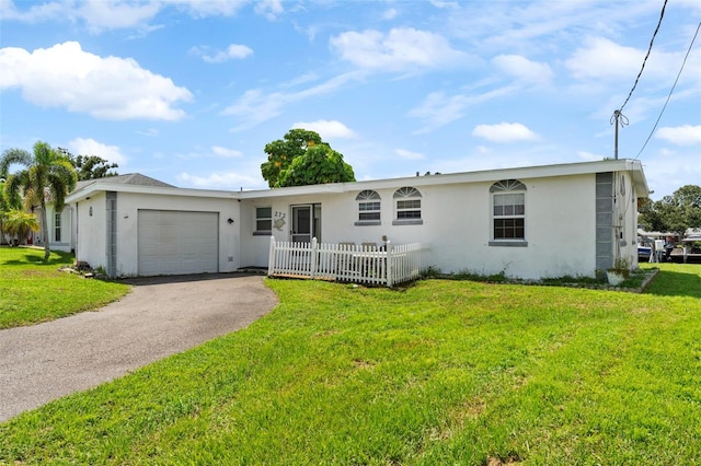 single story home with a front yard and a garage