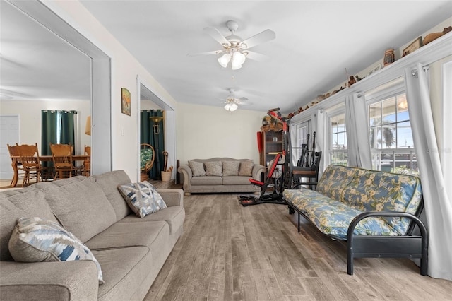 living room with ceiling fan and light hardwood / wood-style floors