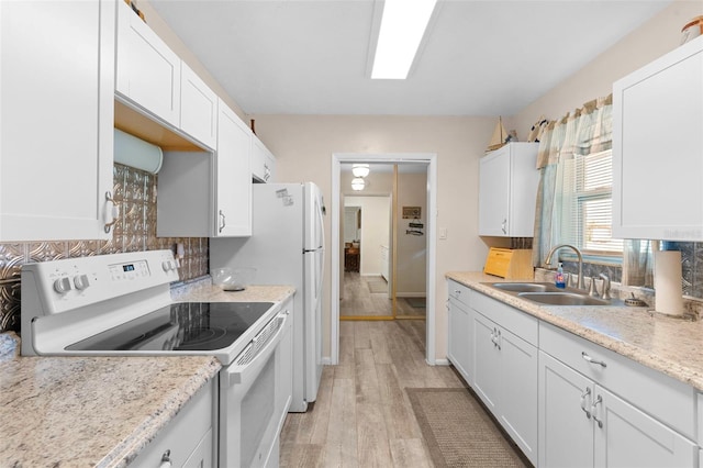 kitchen featuring backsplash, light hardwood / wood-style floors, sink, white range with electric stovetop, and white cabinets