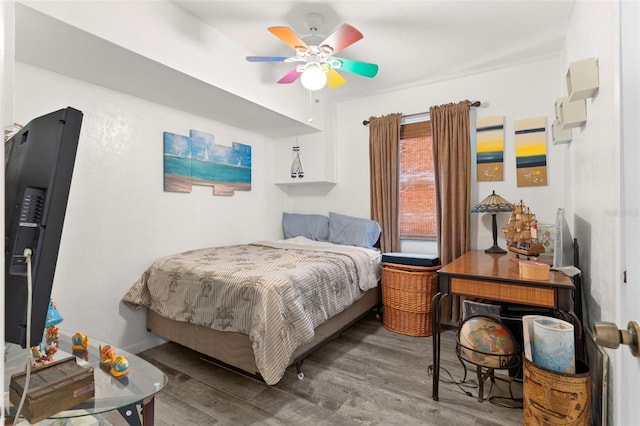 bedroom featuring hardwood / wood-style flooring and ceiling fan