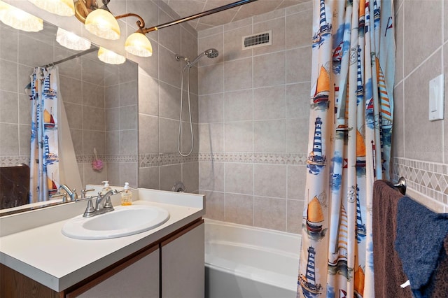 bathroom with shower / bath combo and vanity