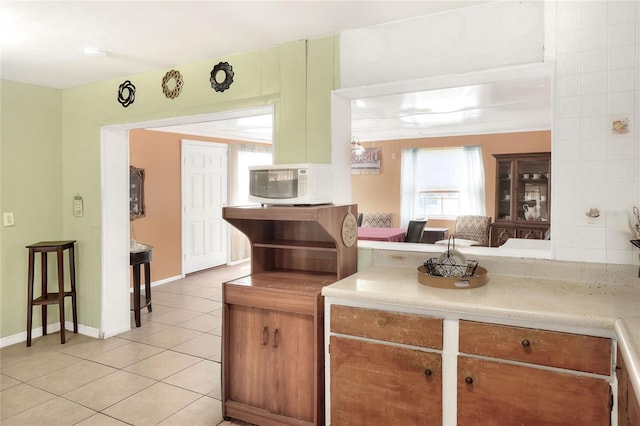 kitchen with light tile patterned floors