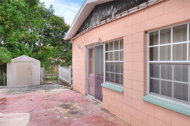 view of patio with a storage unit