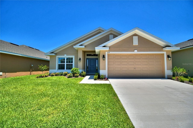 view of front of house featuring a garage and a front yard