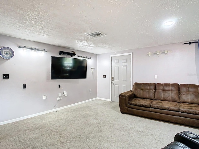 living room with a textured ceiling and carpet