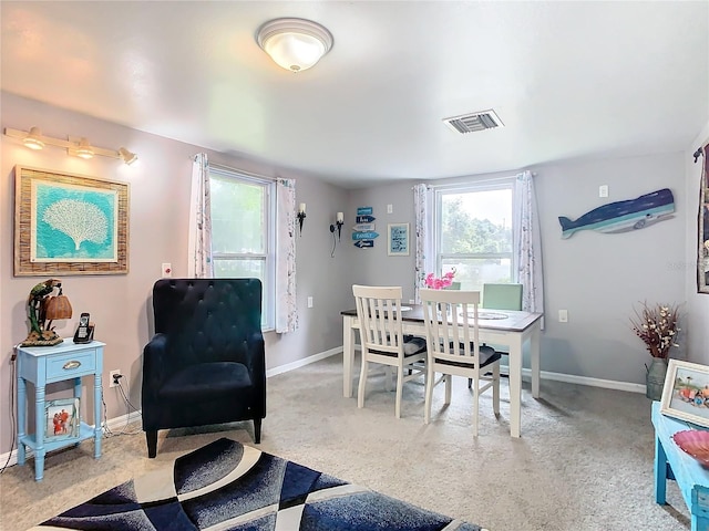 dining area with light colored carpet