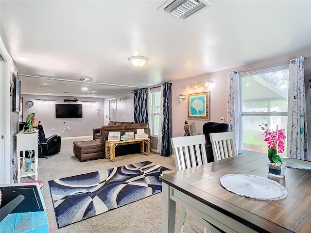 view of carpeted dining area