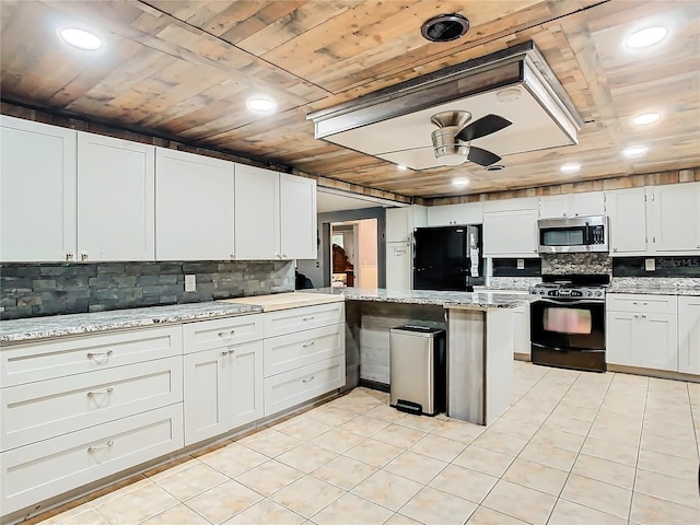 kitchen featuring light tile patterned flooring, white cabinetry, black appliances, light stone countertops, and ceiling fan