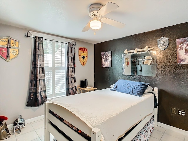 tiled bedroom featuring ceiling fan