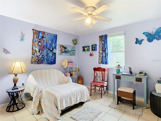 tiled bedroom featuring ceiling fan