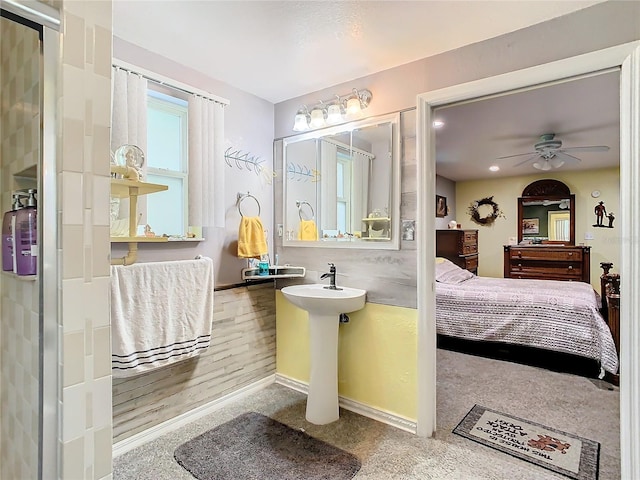 bathroom with ceiling fan and wood-type flooring