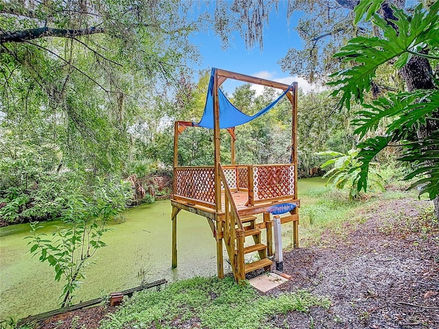 view of play area with a water view