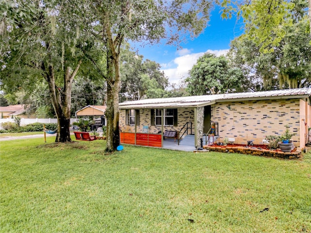 single story home with a front lawn