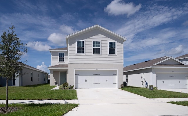 view of front of home featuring central AC, a front yard, and a garage