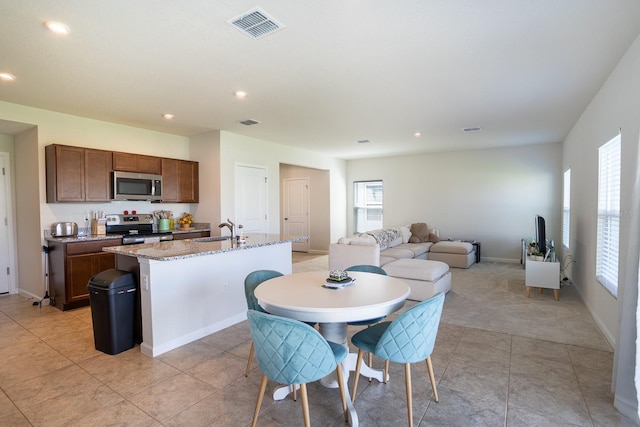 tiled dining room with sink