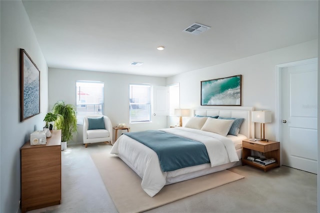 bedroom featuring light colored carpet