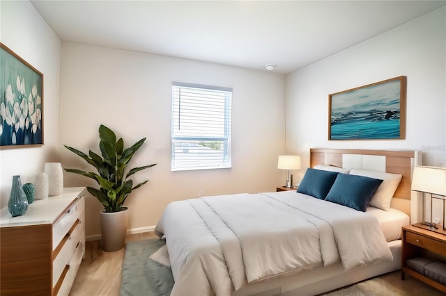 bedroom with light hardwood / wood-style floors