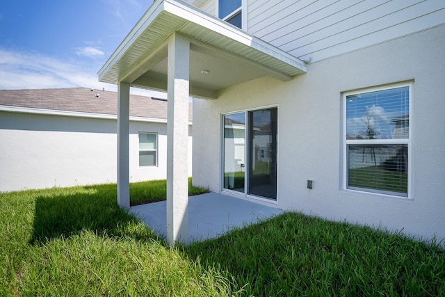5031 Starboard St, Haines City, FL 33844 - exterior space featuring a lawn, a patio, and stucco siding
