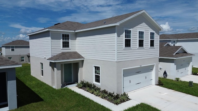 front facade with a front lawn and a garage