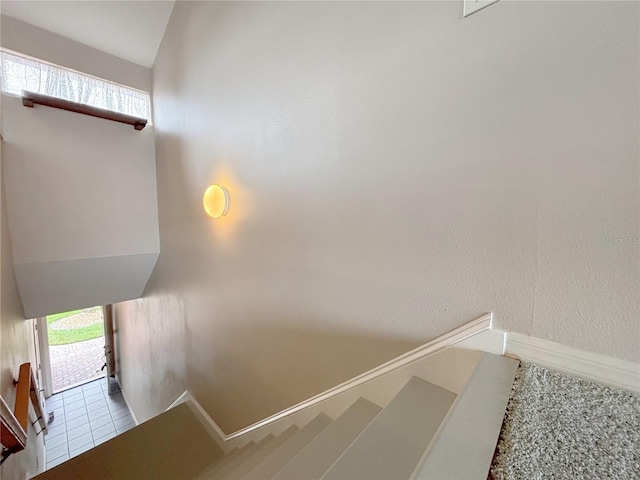 staircase with tile patterned flooring