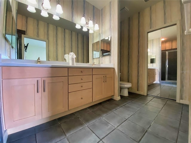 bathroom featuring vanity, toilet, and tile patterned floors