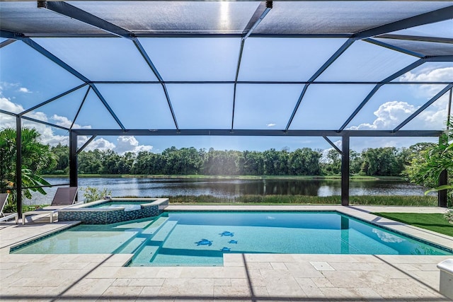 view of swimming pool with a lanai, a water view, a patio, and an in ground hot tub