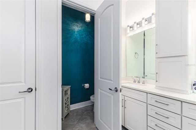 bathroom with tile patterned floors, toilet, and vanity