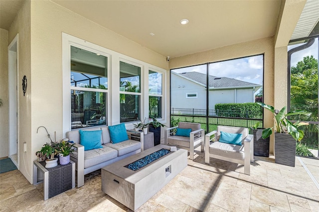 view of patio featuring an outdoor living space with a fire pit