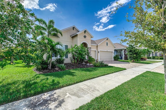 view of front facade featuring a front lawn and a garage