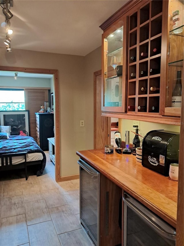 interior space featuring light hardwood / wood-style flooring, beverage cooler, and butcher block counters