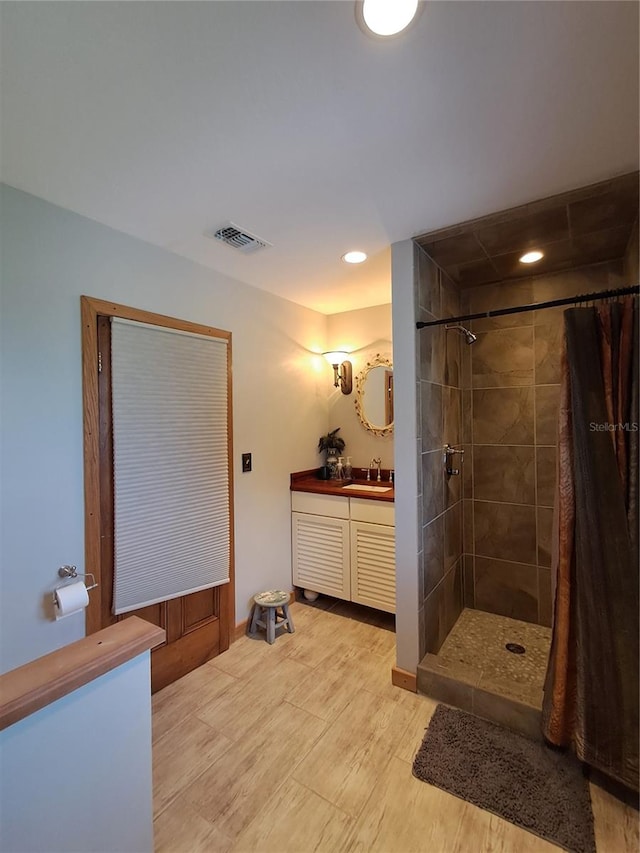 bathroom with vanity and curtained shower