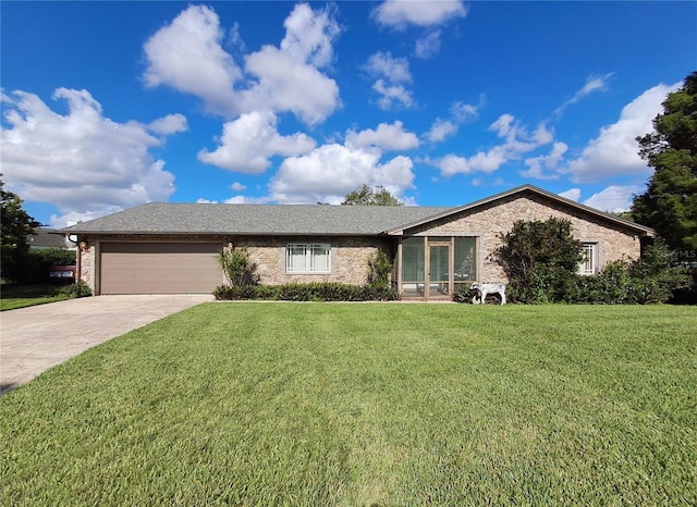 ranch-style house with a garage and a front lawn