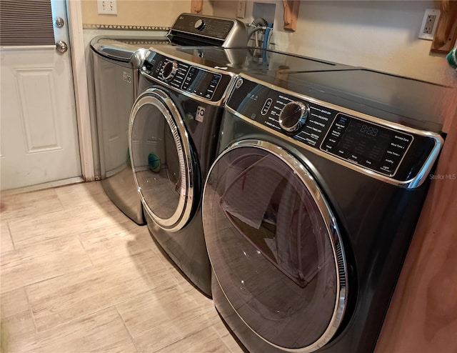 laundry room with washer and dryer