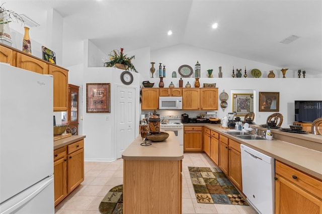 kitchen with white appliances, a center island, sink, high vaulted ceiling, and light tile patterned flooring