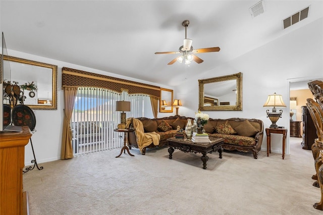 living room featuring lofted ceiling, ceiling fan, and carpet flooring