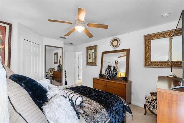 bedroom with carpet flooring, a closet, and ceiling fan