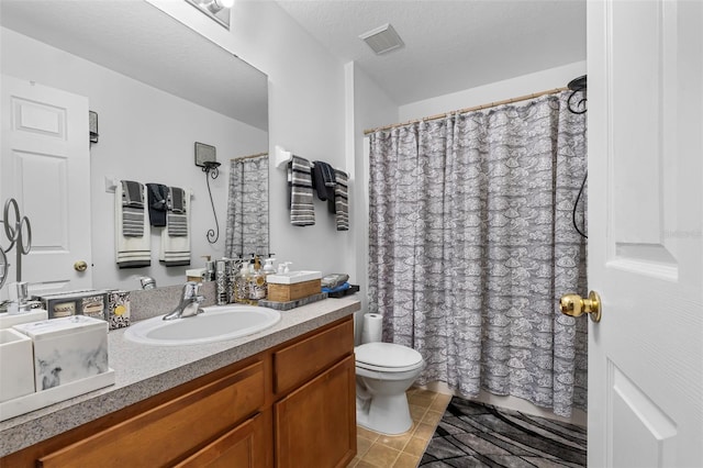 bathroom with walk in shower, toilet, a textured ceiling, and vanity