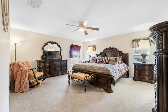 carpeted bedroom with ceiling fan