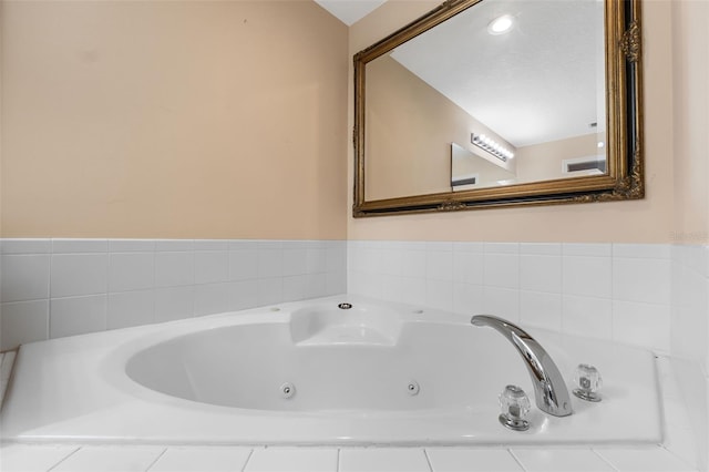 bathroom featuring tiled bath