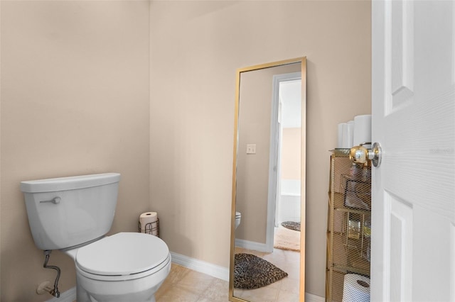 bathroom featuring toilet and tile patterned floors