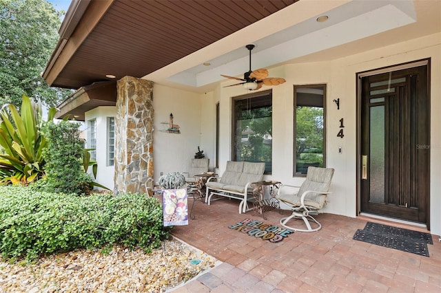 property entrance featuring ceiling fan