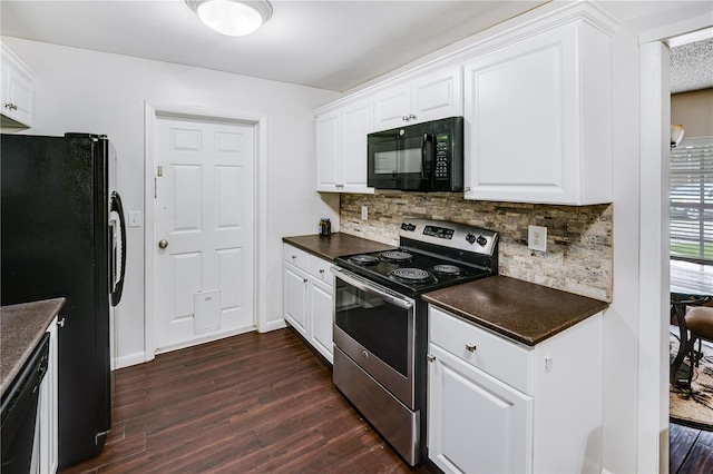 kitchen featuring white cabinets, dark wood-style floors, dark countertops, black appliances, and decorative backsplash