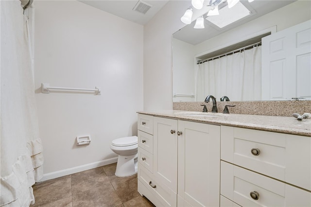 bathroom featuring visible vents, baseboards, toilet, vanity, and tile patterned flooring
