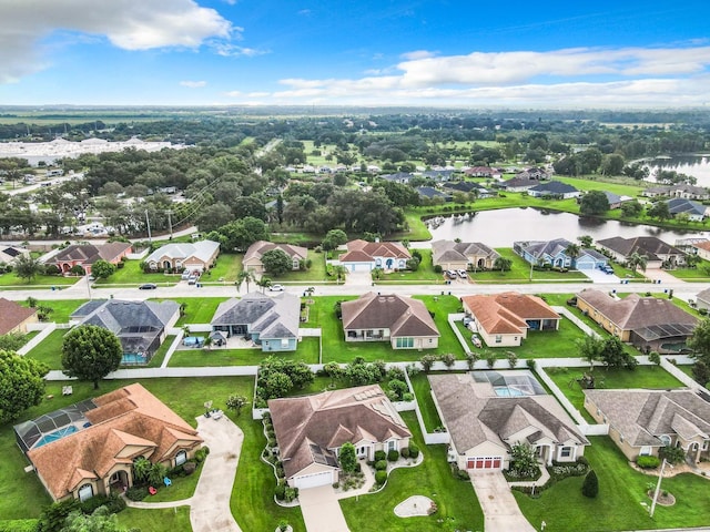 bird's eye view featuring a residential view and a water view