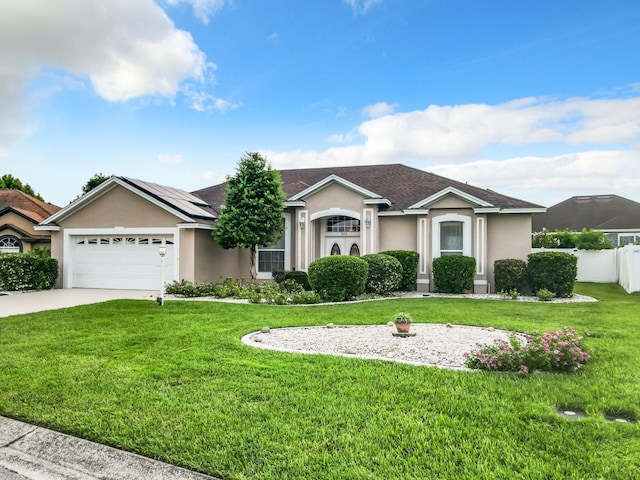 ranch-style home with fence, a front yard, stucco siding, driveway, and an attached garage