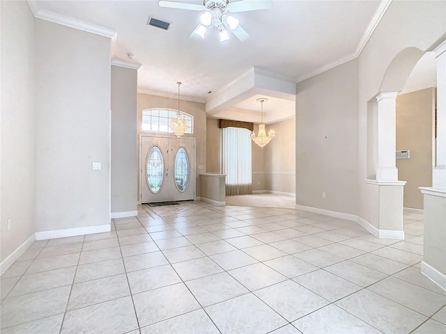 foyer with light tile patterned floors, visible vents, ornamental molding, and ornate columns