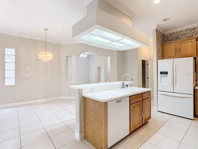 kitchen featuring white appliances, ornamental molding, light tile patterned flooring, and a sink